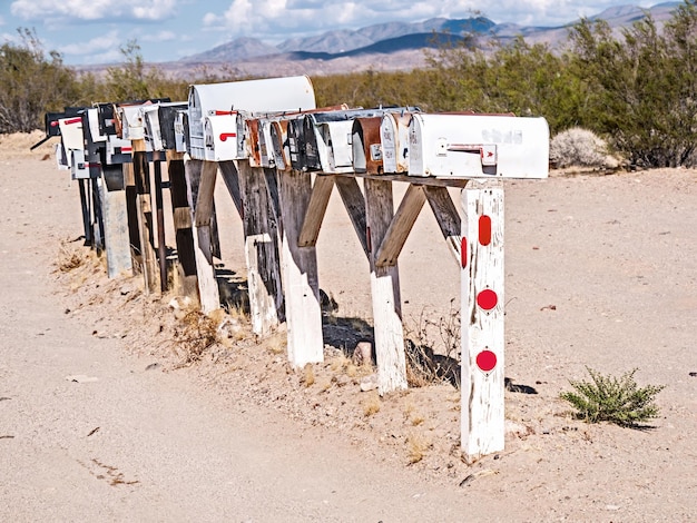 A stylized depiction of the US border, showing various elements of border security measures like fences, drones, and patrol vehicles.
