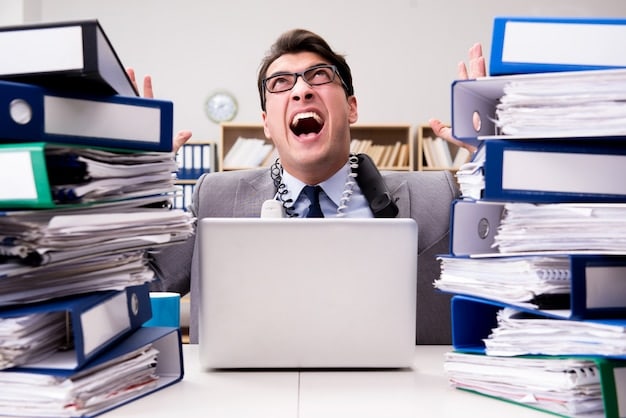 A person working on a laptop with a determined expression, surrounded by documents and folders related to student loans, financial statements, and application forms, signifying the effort required to navigate the loan forgiveness process.