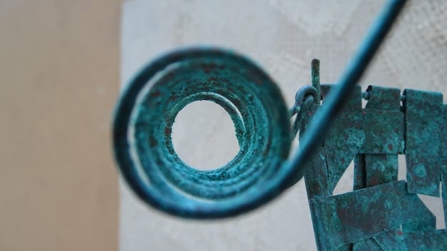 A close-up view of the nozzle of a 3D printer extruding concrete layers to form the wall of a house. The focus is on the precision and detail of the printing process, highlighting the layered structure of the wall and the robotic arm guiding the nozzle.
