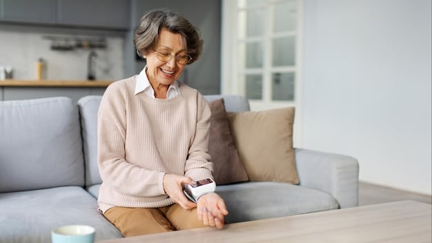 A senior woman smiling while wearing a smartwatch that monitors her vital signs, showcasing how wearable technology aids in health management for aging in place.