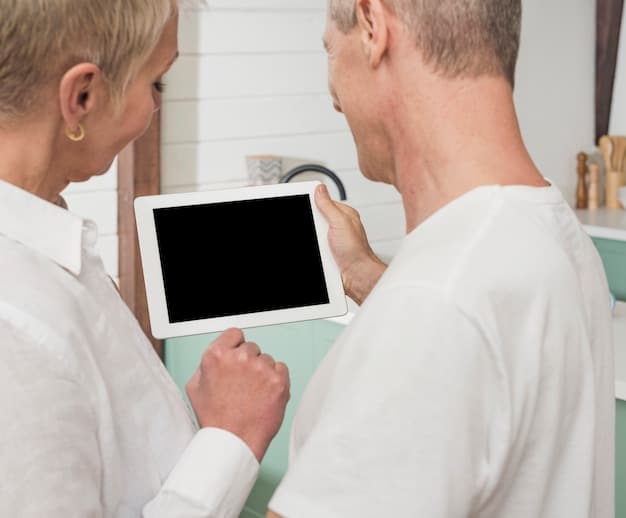 A doctor and a patient discussing genomic testing results in a modern home setting. The patient is looking at a tablet displaying a clear and easy-to-understand infographic of their genetic profile.