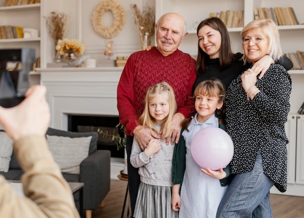 A family portrait of three generations - grandparents, parents, and young children - all smiling and wearing 