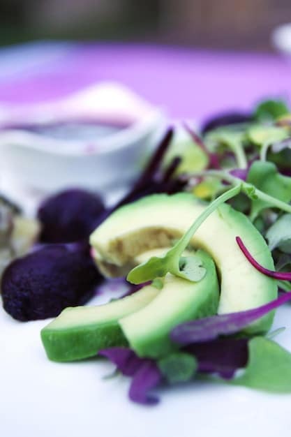 A close-up shot of various plant-based ingredients commonly found in organic multivitamins, such as spinach, kale, blueberries, and spirulina. Each ingredient should look fresh and vibrant.