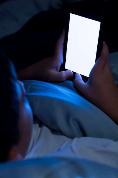 A person tossing and turning in bed at night, illuminated by the faint glow of a smartphone screen. The scene conveys insomnia and sleep disturbance.
