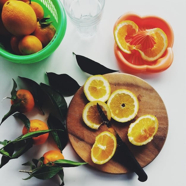 A still life composition featuring a variety of Vitamin C-rich foods, including sliced oranges, red bell peppers, kiwi, and broccoli florets, arranged artfully in a bowl, with soft natural light coming from a nearby window.