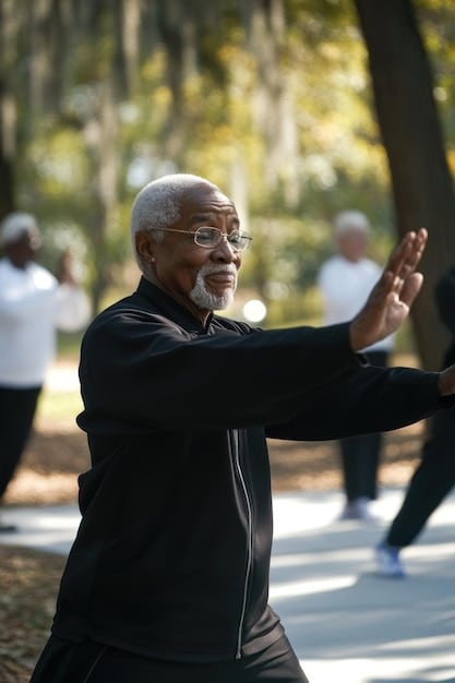 A senior man practicing Tai Chi in a park with a group of people, demonstrating how Tai Chi can improve balance and coordination for fall prevention.