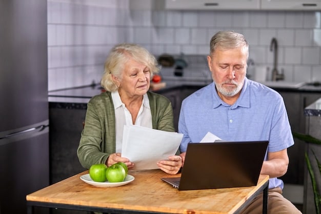 An older couple looking worried while reviewing a stack of medical bills at their kitchen table.