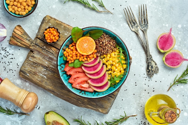 A visually appealing image of a colorful plate filled with vegetables, lean protein, and healthy fats, emphasizing the importance of a balanced diet during intermittent fasting. The setting is a bright, modern kitchen.